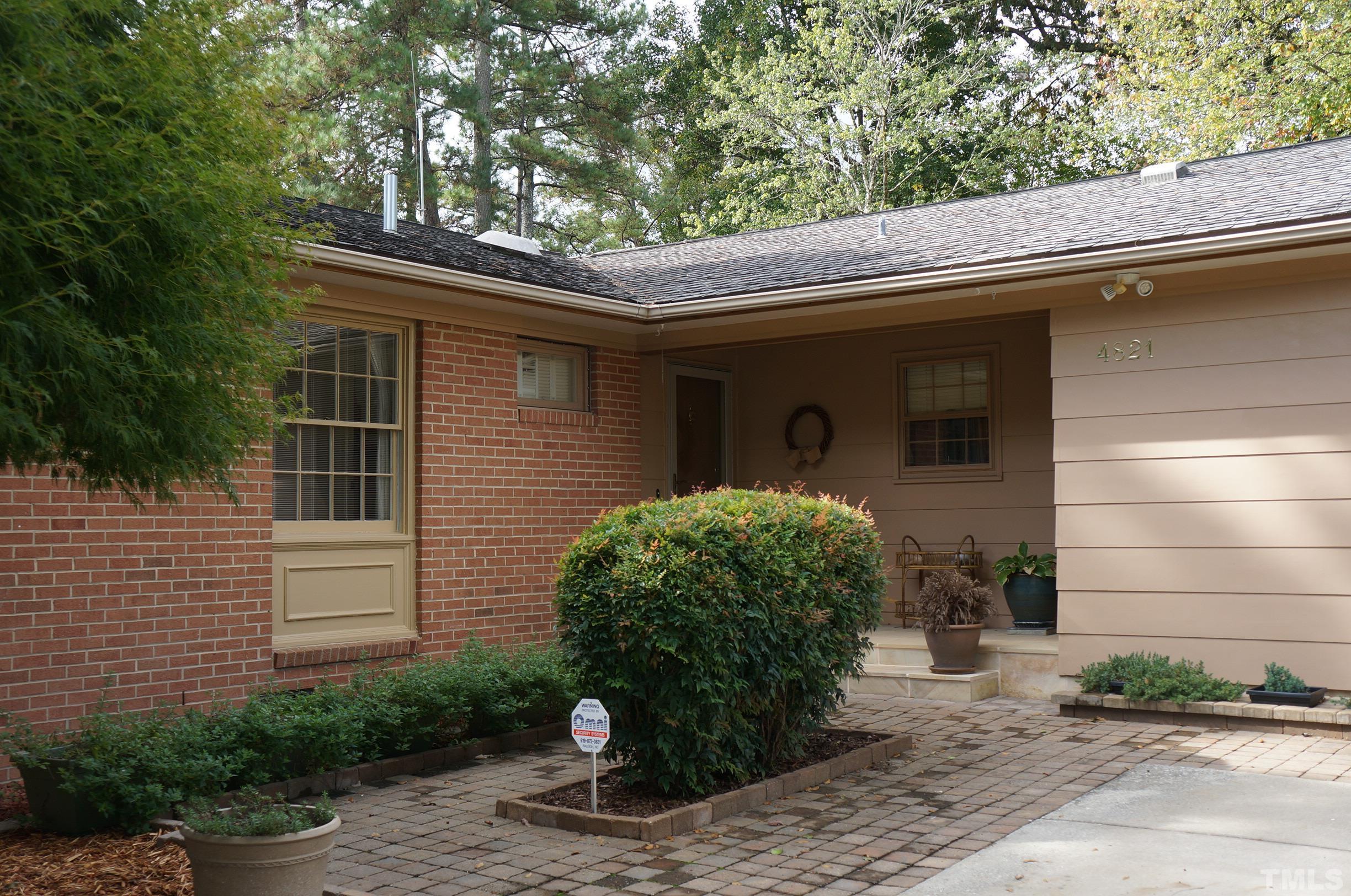 4821 Latimer Road Raleigh, NC 27609 - Photo 3 of 21 a front view of a house with garden