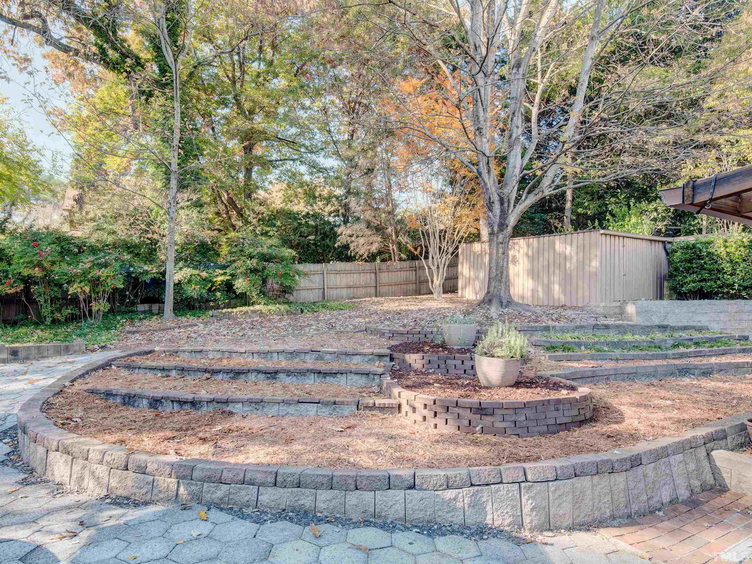 4821 Latimer Road Raleigh, NC 27609 - Photo 5 of 21 a view of a yard with tree s
