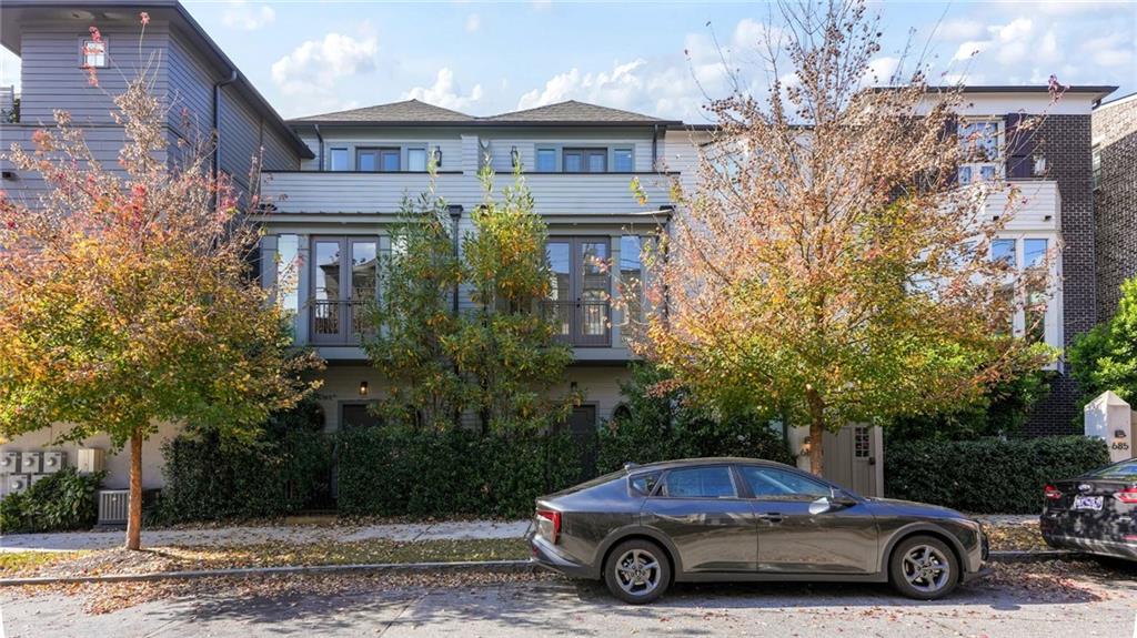 a car parked in front of a brick house