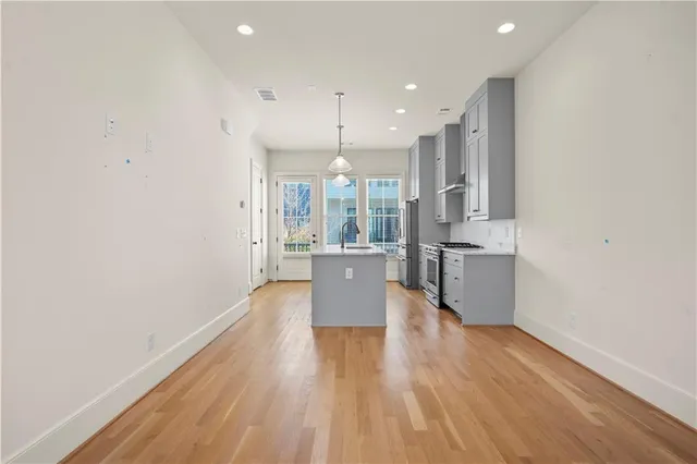 a view of kitchen with wooden floor