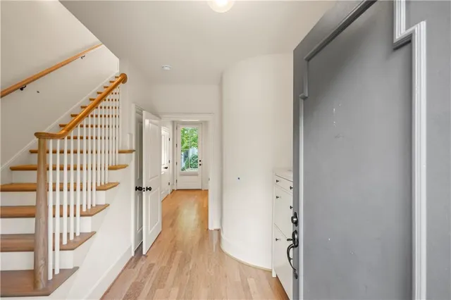 a view of entryway with wooden floor