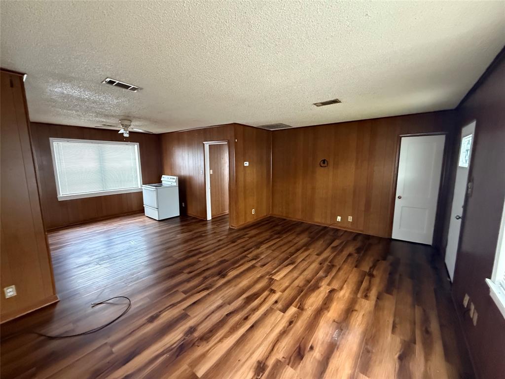 301 Boyd Loop Bonham, TX 75418 - Photo 4 of 11 a view of empty room with wooden floor