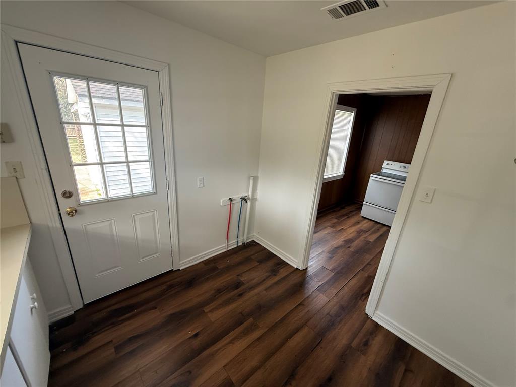 301 Boyd Loop Bonham, TX 75418 - Photo 9 of 11 an entryway with wooden floor and stairs