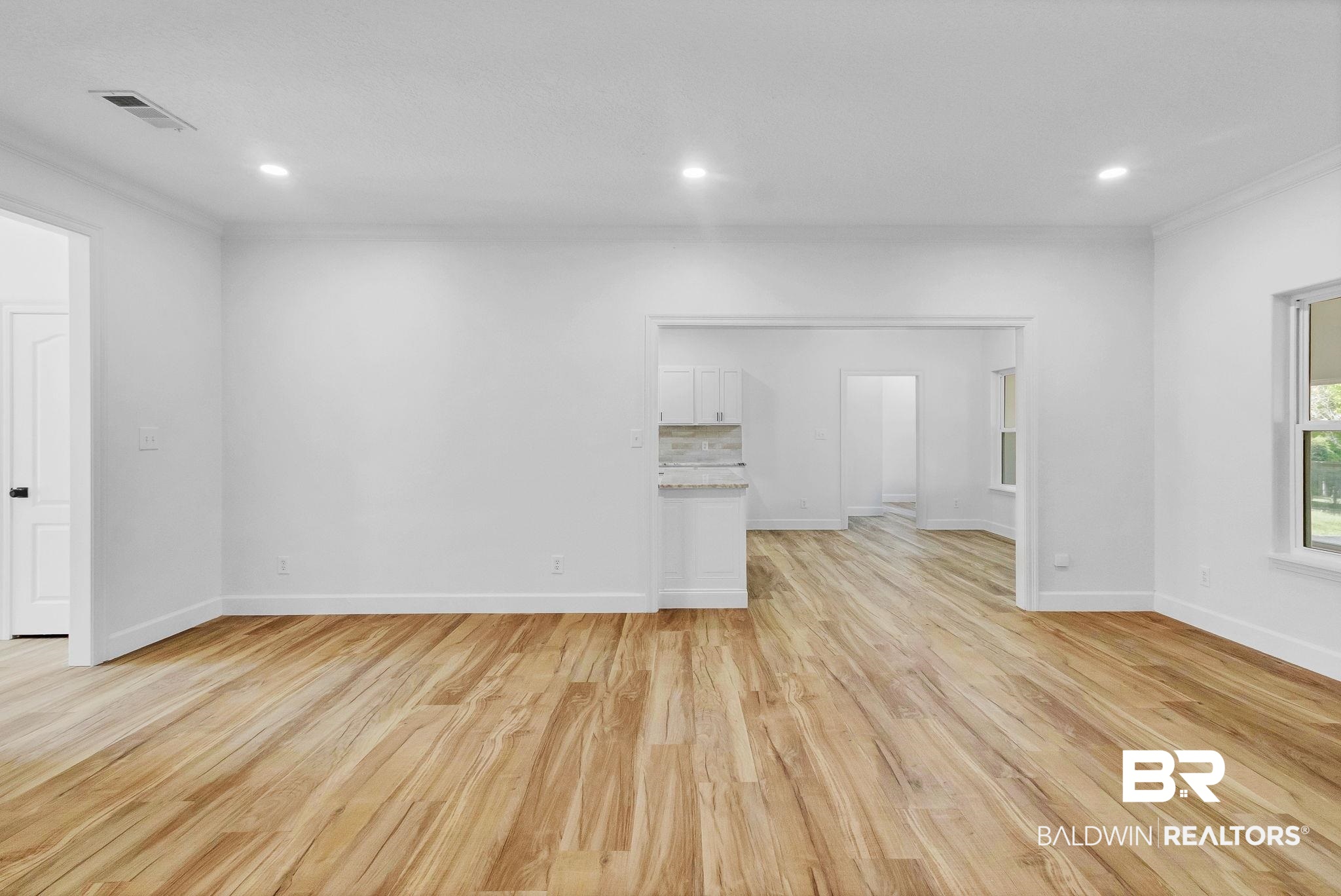 20265 Erin Pond Road Seminole, AL 36574 - Photo 91 of 97 Unfurnished room with light wood-style flooring, recessed lighting, baseboards, and visible vents