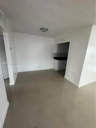 a view of a room with a sink and dishwasher