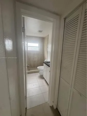 a bathroom with a glass door shower