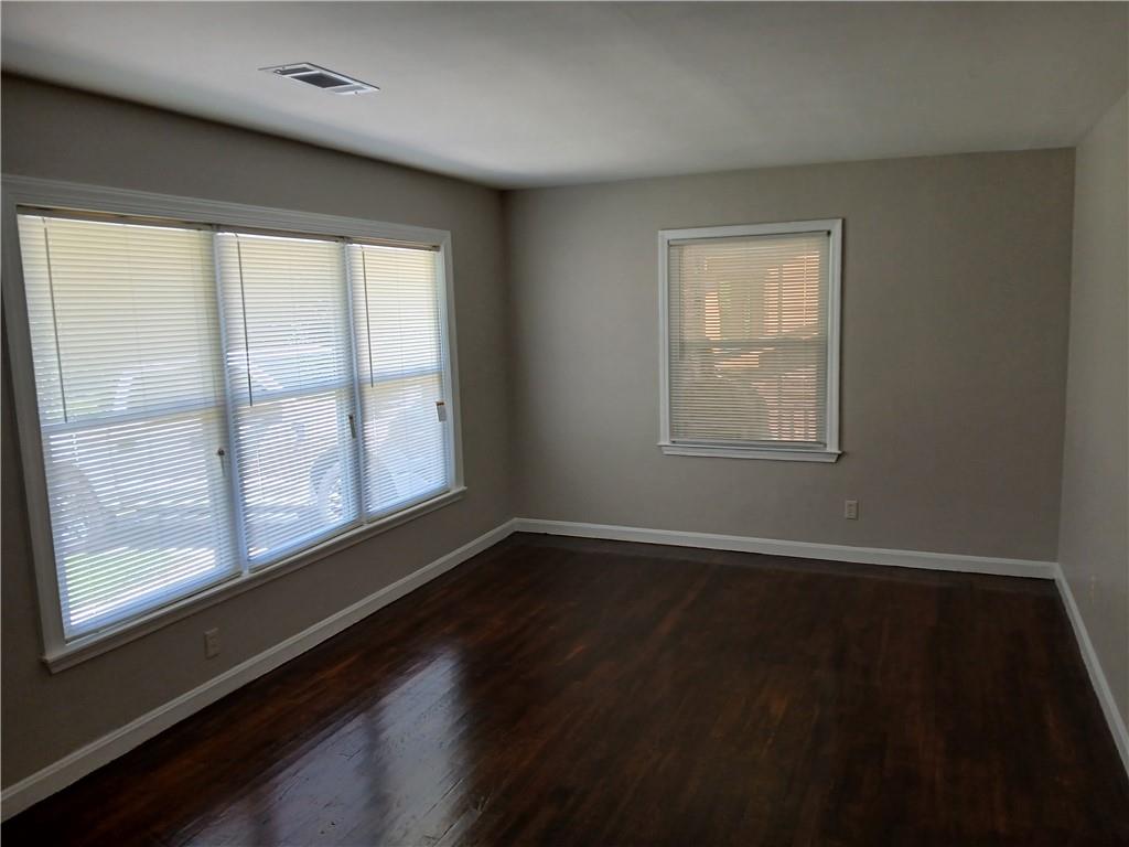 3175 Bellgreen Way Decatur, GA 30032 - Photo 10 of 10 an empty room with wooden floor and windows