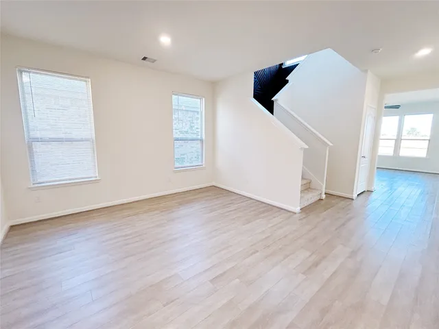 a view of a big room with carpet