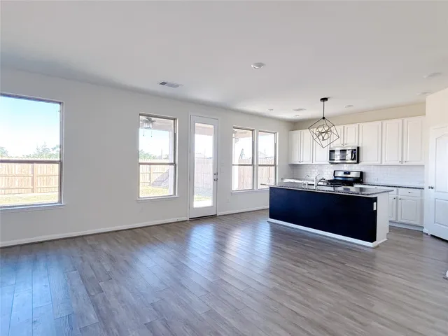 a view of empty room with windows