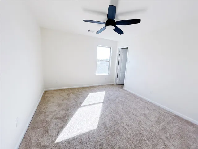 a view of empty room with windows
