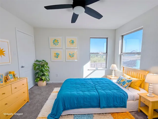 a bathroom with a granite countertop sink a toilet and a mirror