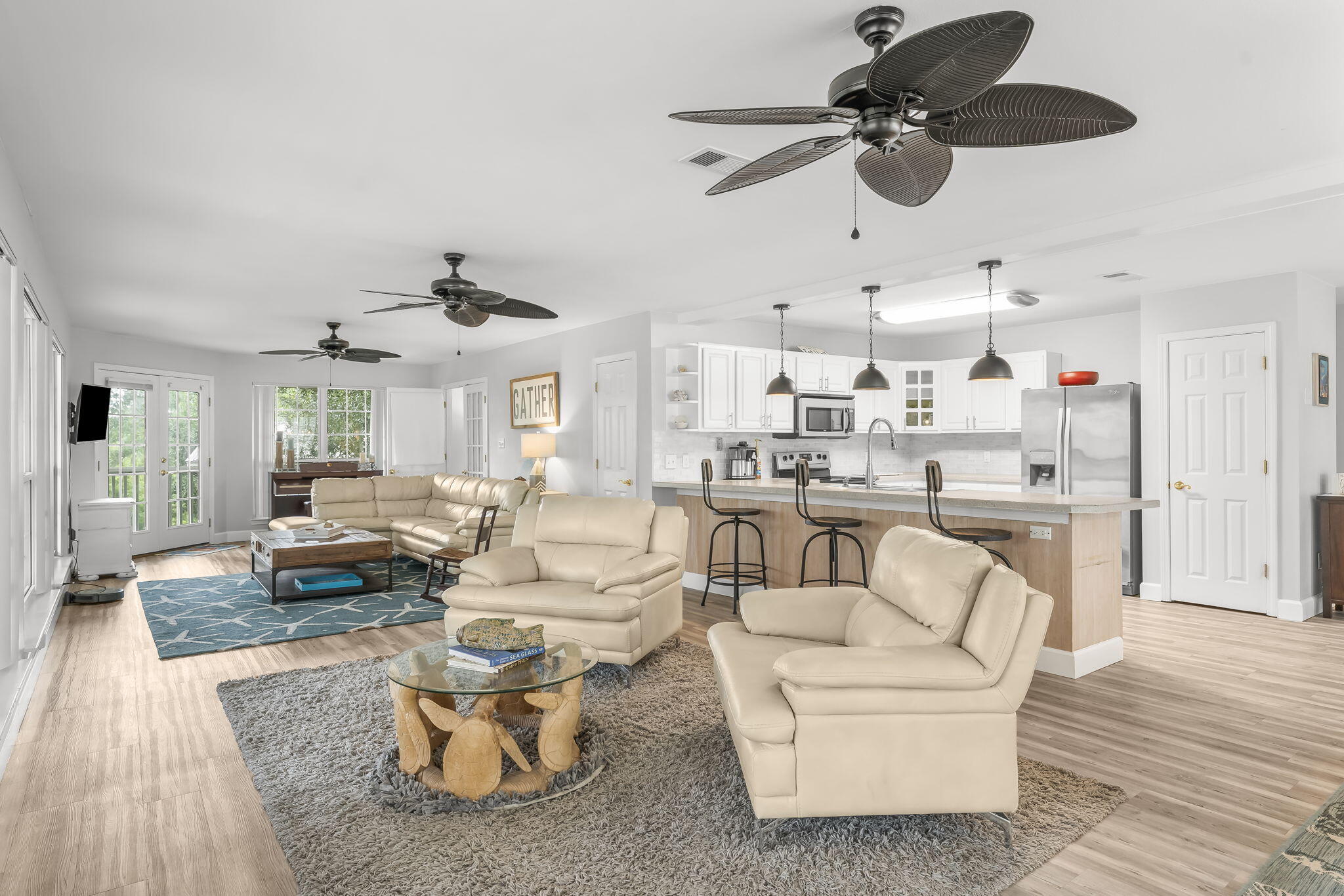 193 Portland Park Road Freeport, FL 32439 - Photo 11 of 62 a living room with furniture kitchen view and a chandelier