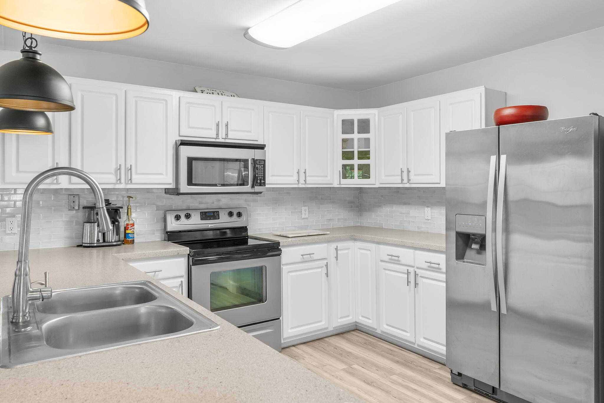 193 Portland Park Road Freeport, FL 32439 - Photo 14 of 62 a kitchen with granite countertop a sink stainless steel appliances and white cabinets