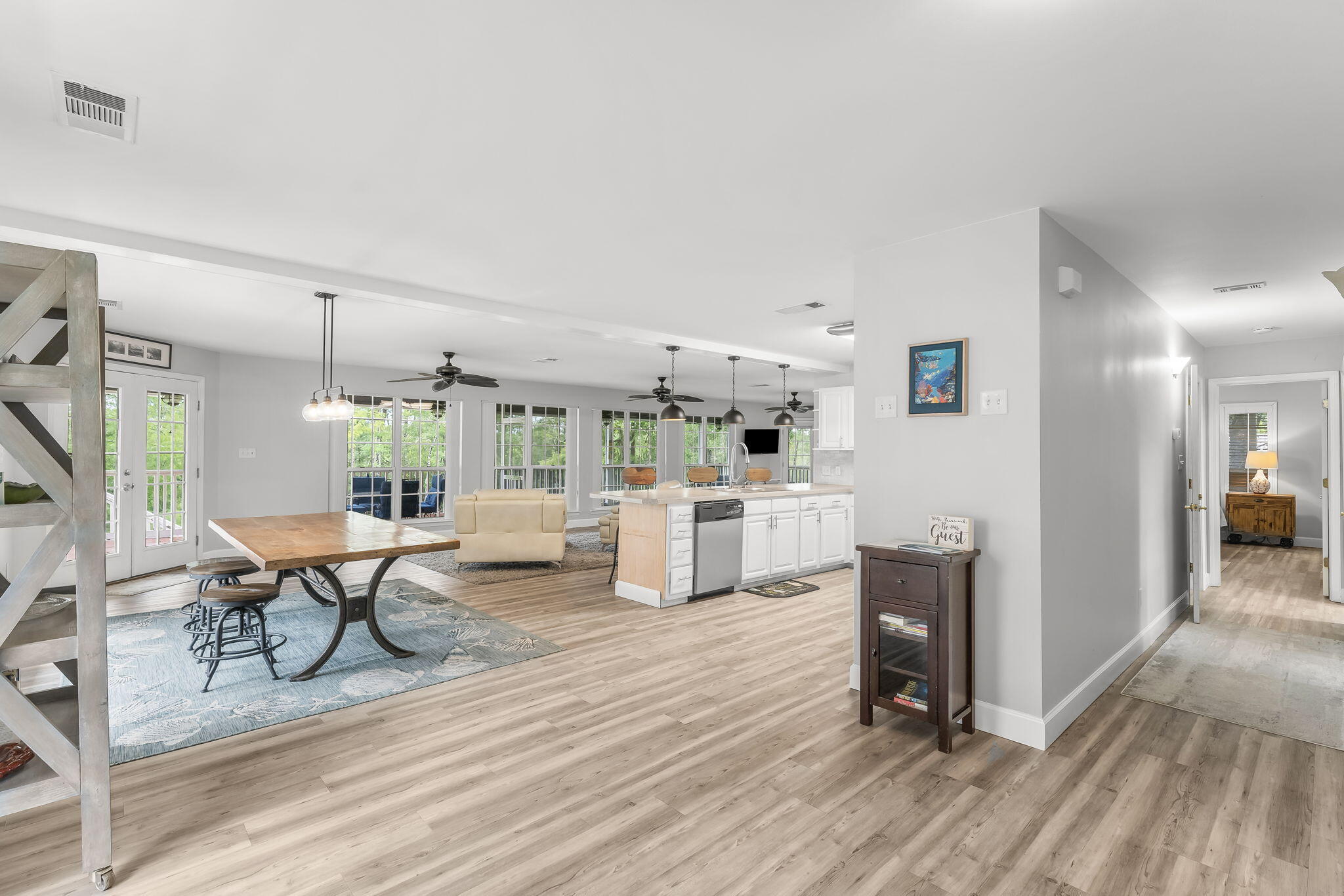 193 Portland Park Road Freeport, FL 32439 - Photo 17 of 62 a living room with furniture a dining table and chairs with wooden floor