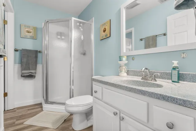 a bedroom with a bed and a lamp