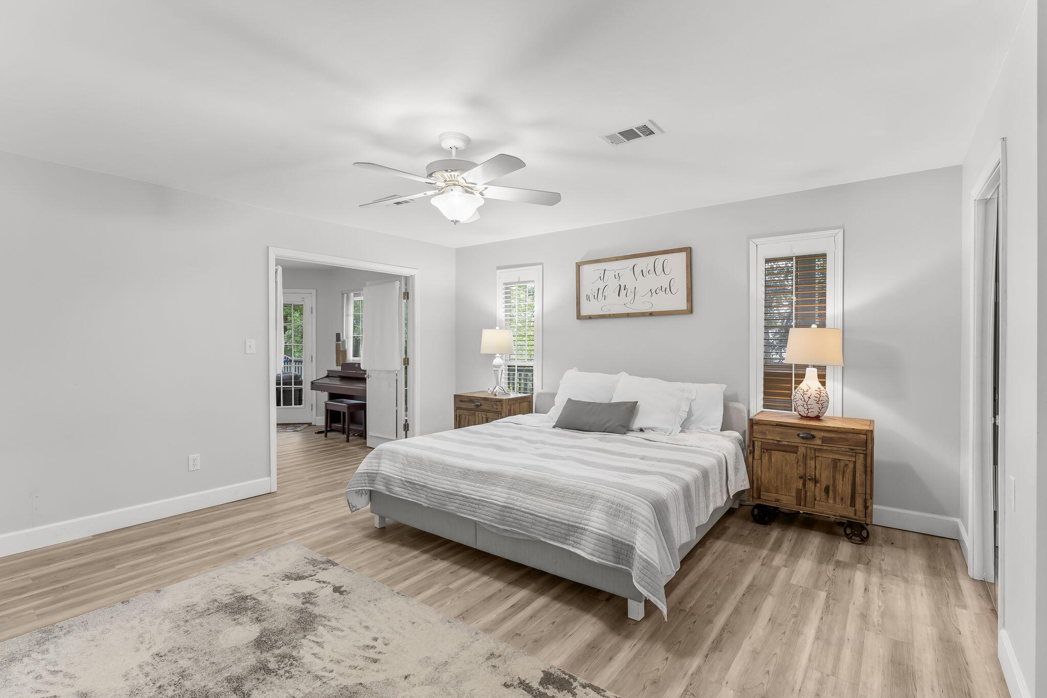 193 Portland Park Road Freeport, FL 32439 - Photo 26 of 62 a bedroom with a bed and a chandelier