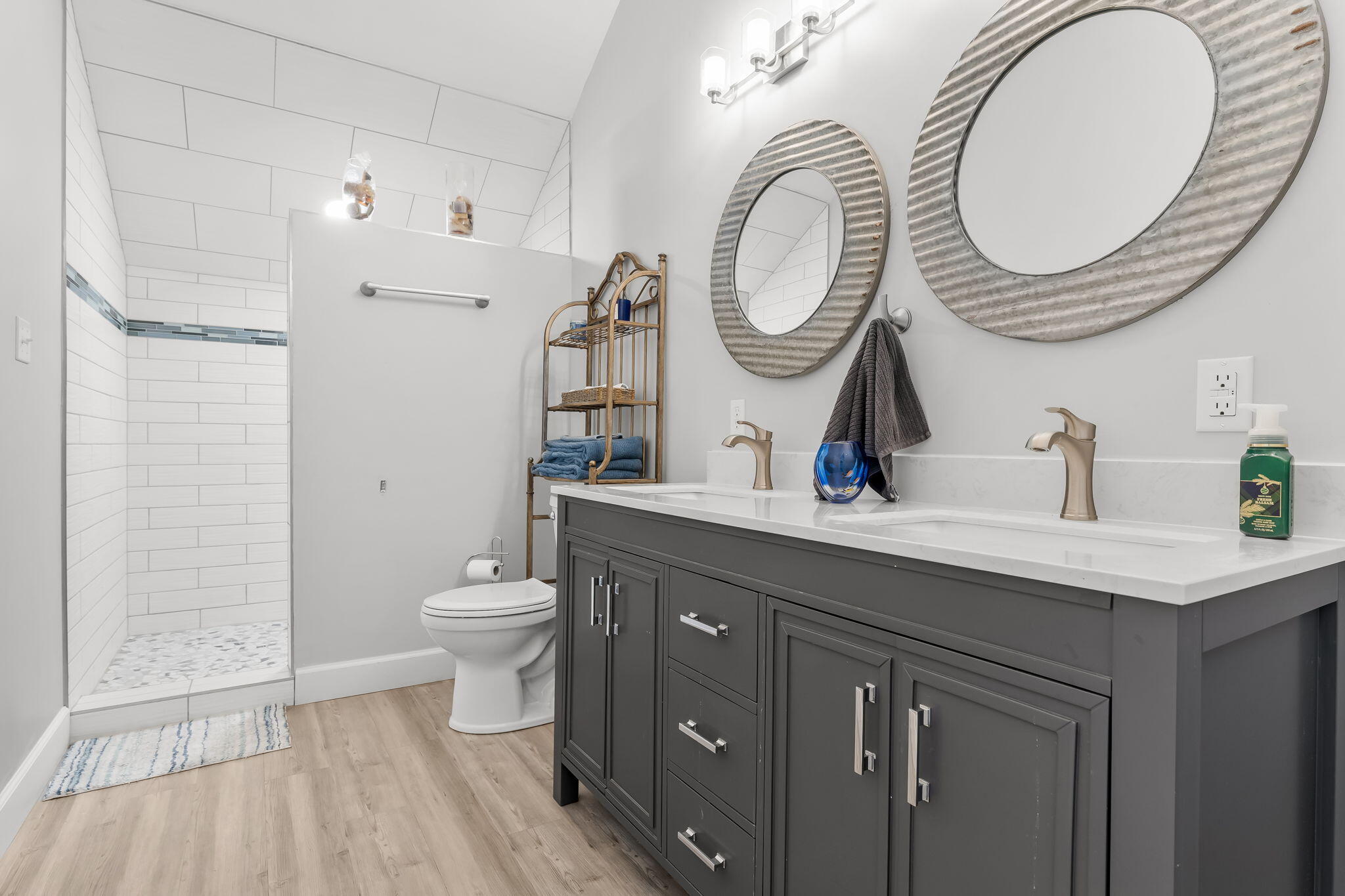 193 Portland Park Road Freeport, FL 32439 - Photo 29 of 62 a bathroom with a toilet a sink and a mirror