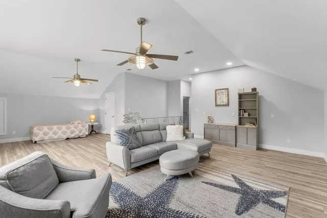 a bathroom with a toilet a sink and a mirror