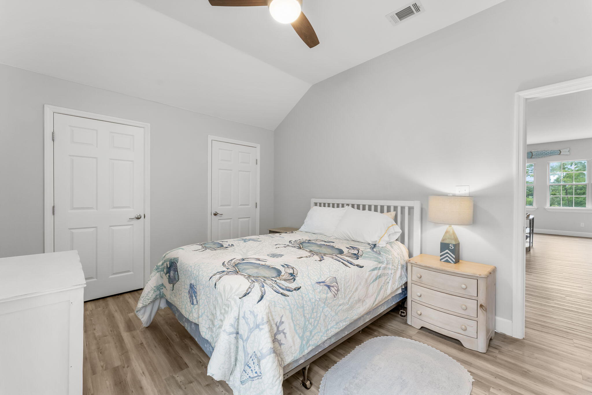 193 Portland Park Road Freeport, FL 32439 - Photo 31 of 62 a bedroom with a bed and a chandelier