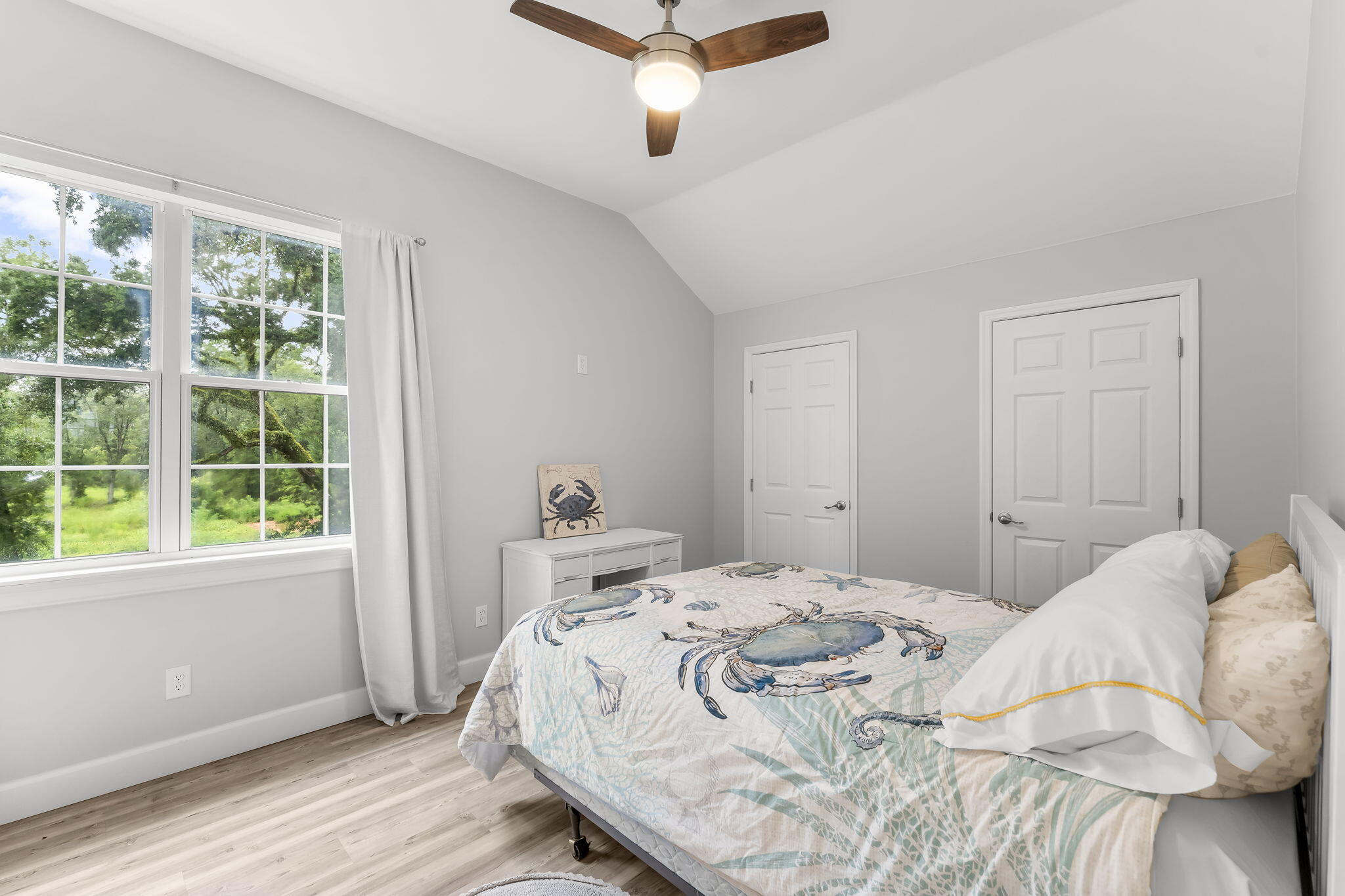 193 Portland Park Road Freeport, FL 32439 - Photo 32 of 62 a bedroom with a bed and wooden floor