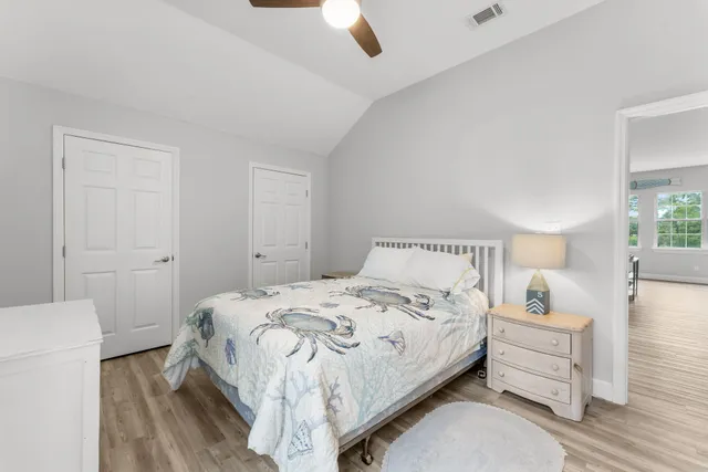 a living room with furniture and a ceiling fan