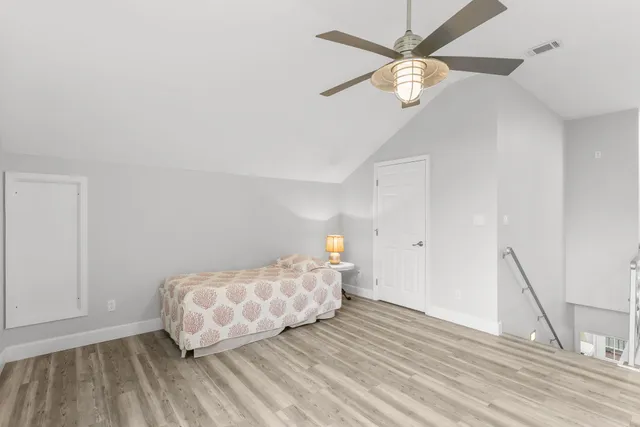 a view of a patio with couches under an umbrella