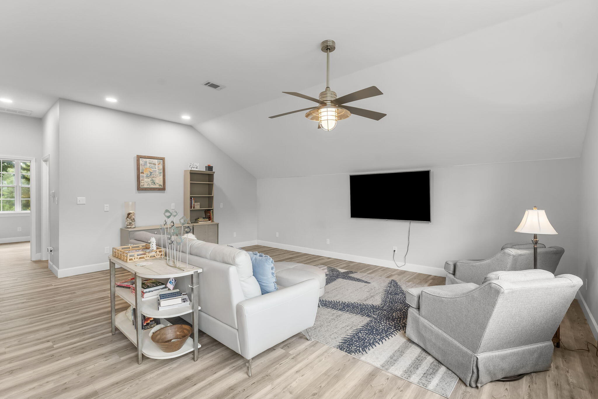 193 Portland Park Road Freeport, FL 32439 - Photo 37 of 62 a living room with furniture and a flat screen tv