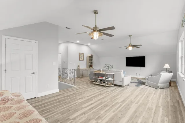 a view of a patio with couches under an umbrella