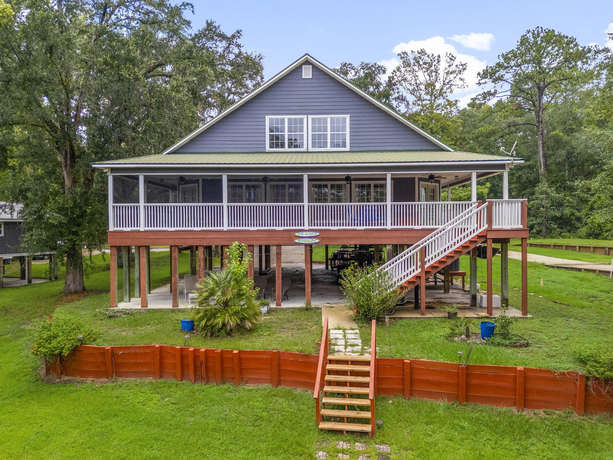 193 Portland Park Road Freeport, FL 32439 - Photo 46 of 62 a front view of a house with a yard