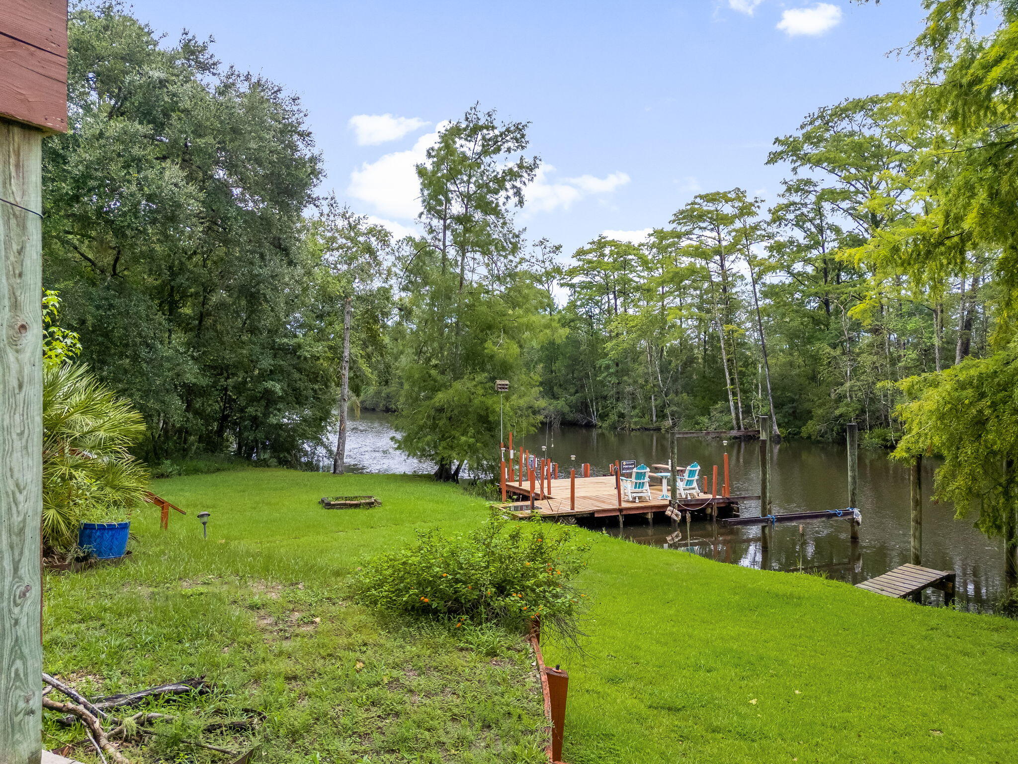 193 Portland Park Road Freeport, FL 32439 - Photo 51 of 62 a view of a garden with a house in the background