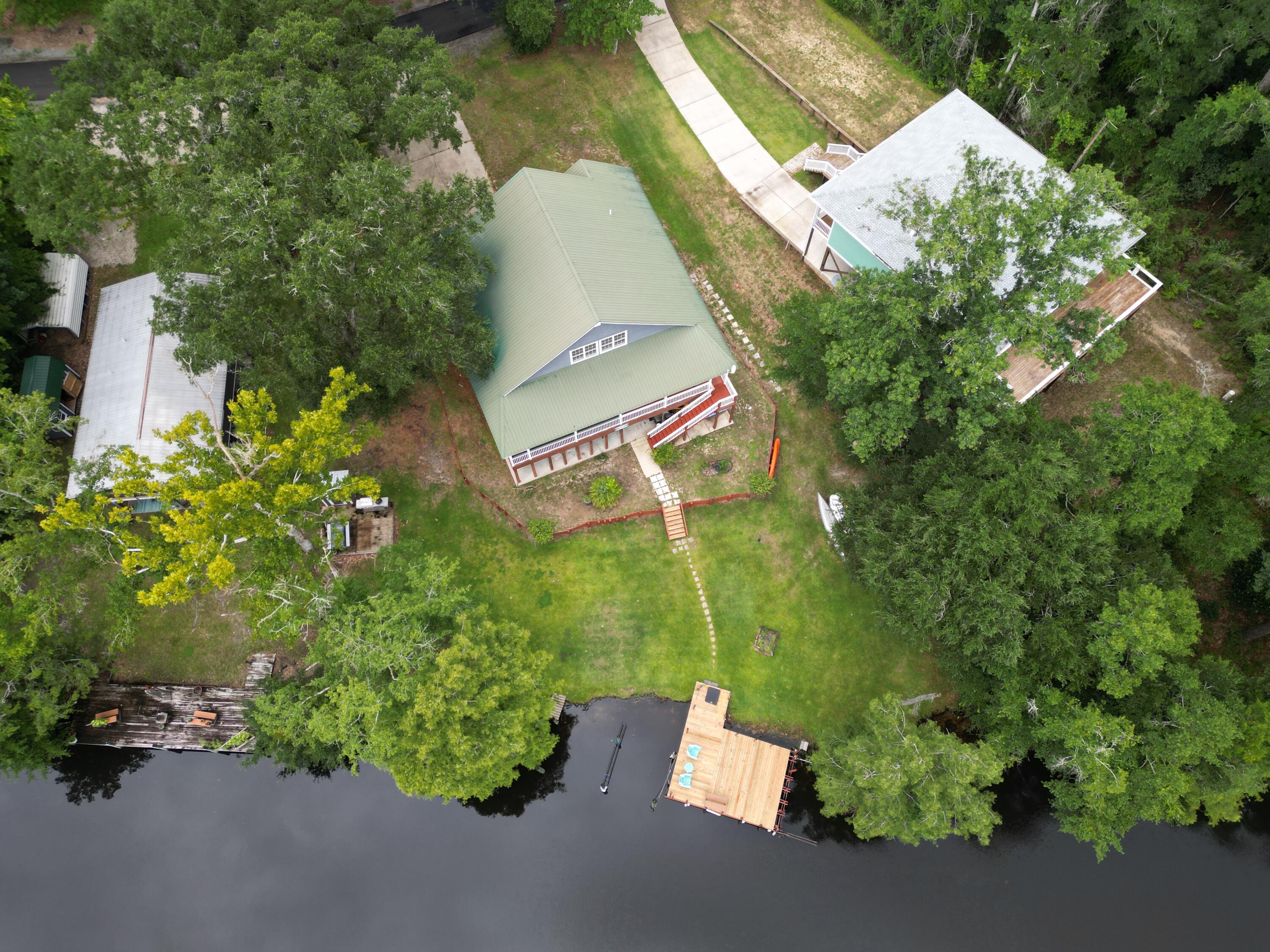 193 Portland Park Road Freeport, FL 32439 - Photo 55 of 62 an aerial view of a house with a yard and garden