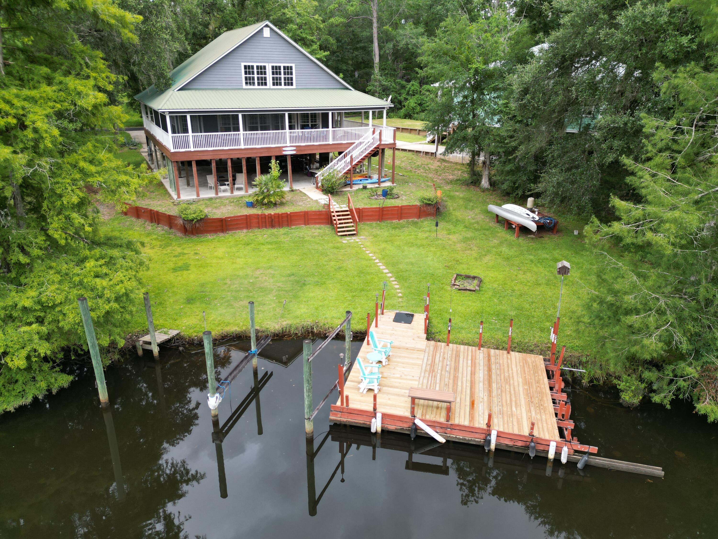 193 Portland Park Road Freeport, FL 32439 - Photo 57 of 62 an aerial view of a house with swimming pool garden view and lake view