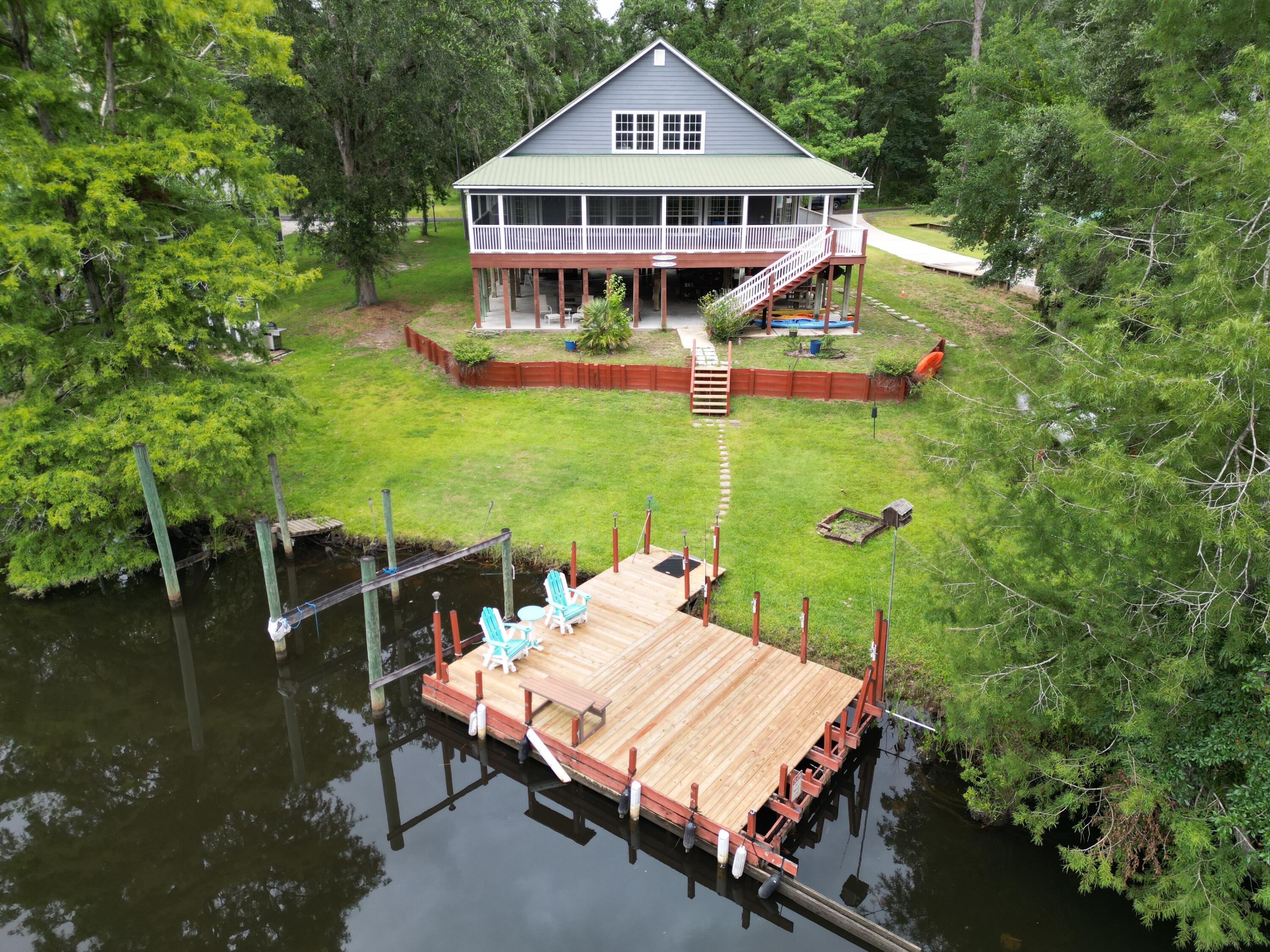 193 Portland Park Road Freeport, FL 32439 - Photo 58 of 62 a view of a house with pool and deck
