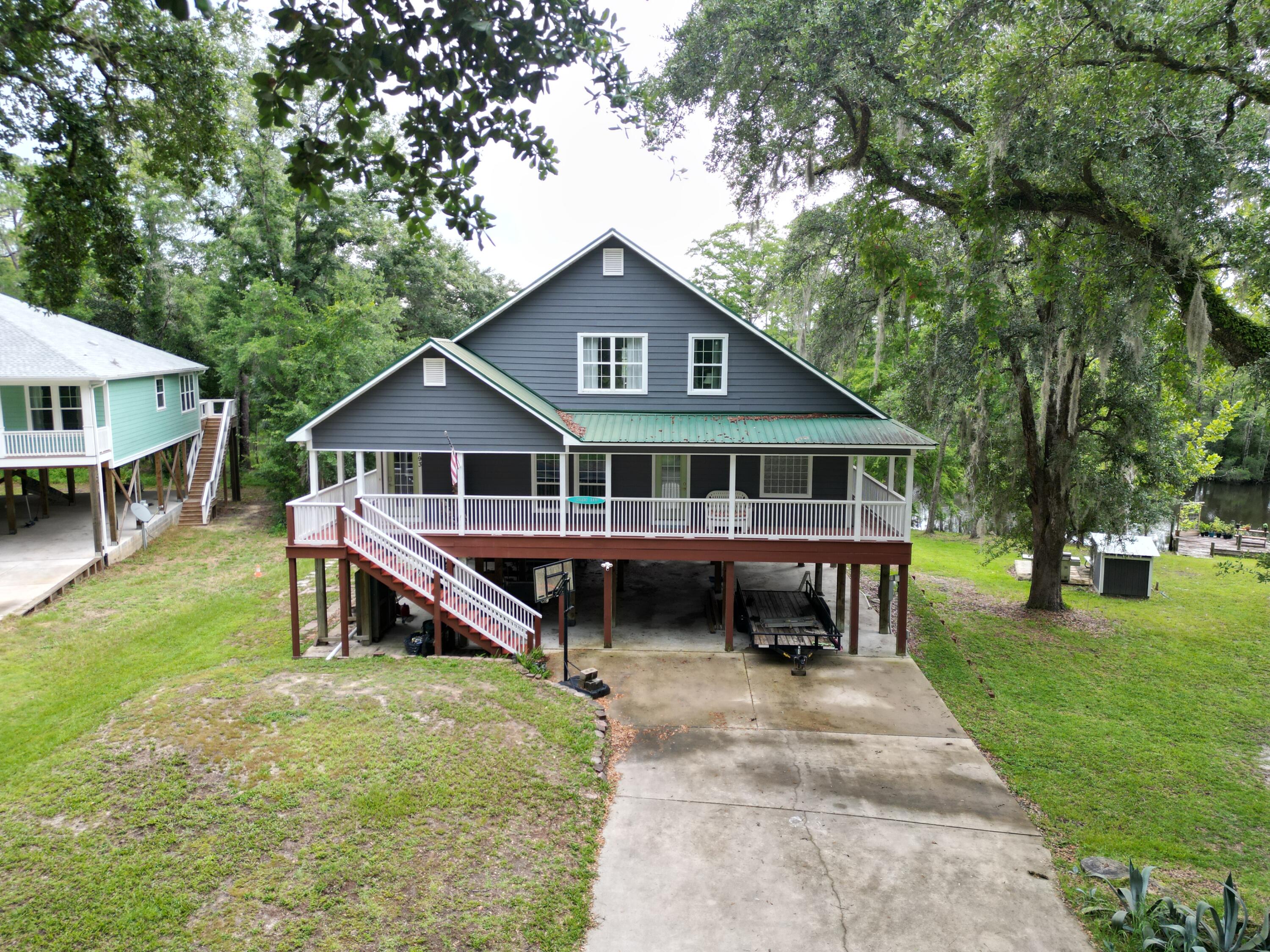 193 Portland Park Road Freeport, FL 32439 - Photo 62 of 62 a front view of a house with garden and trees
