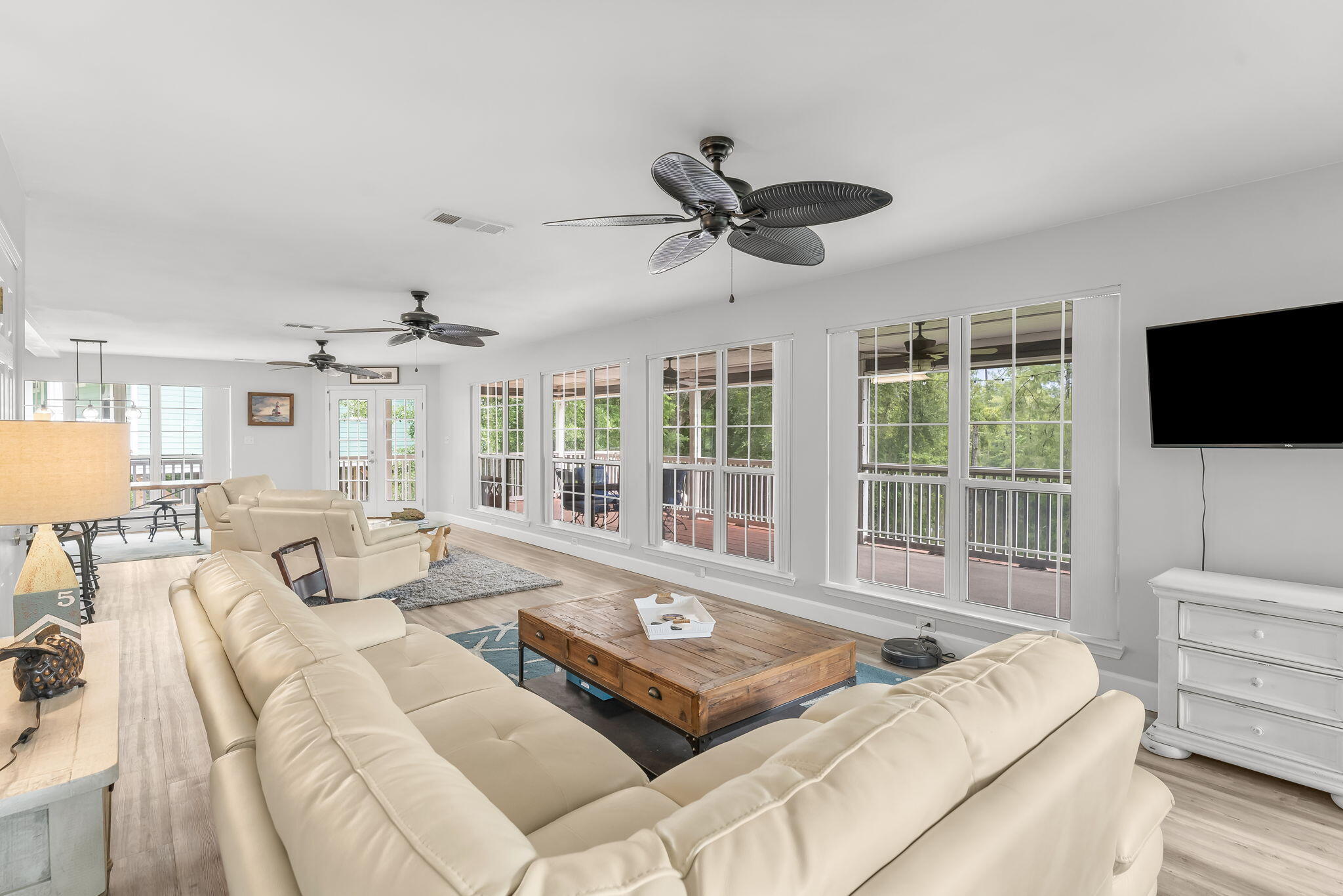 193 Portland Park Road Freeport, FL 32439 - Photo 7 of 62 a living room with furniture a flat screen tv and a large window