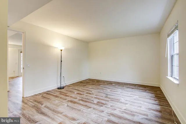 a kitchen with refrigerator and sink