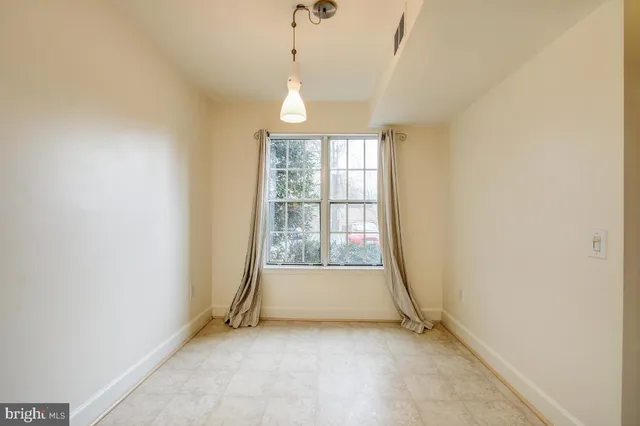 a kitchen with a stove and a refrigerator