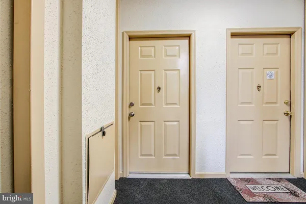 an entryway view with wooden floor