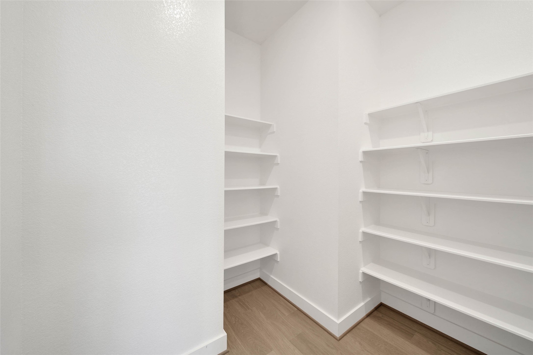 4515 Magnolia Bend Drive Rosharon, TX 77583 - Photo 13 of 46 a view of walk in closet with empty racks