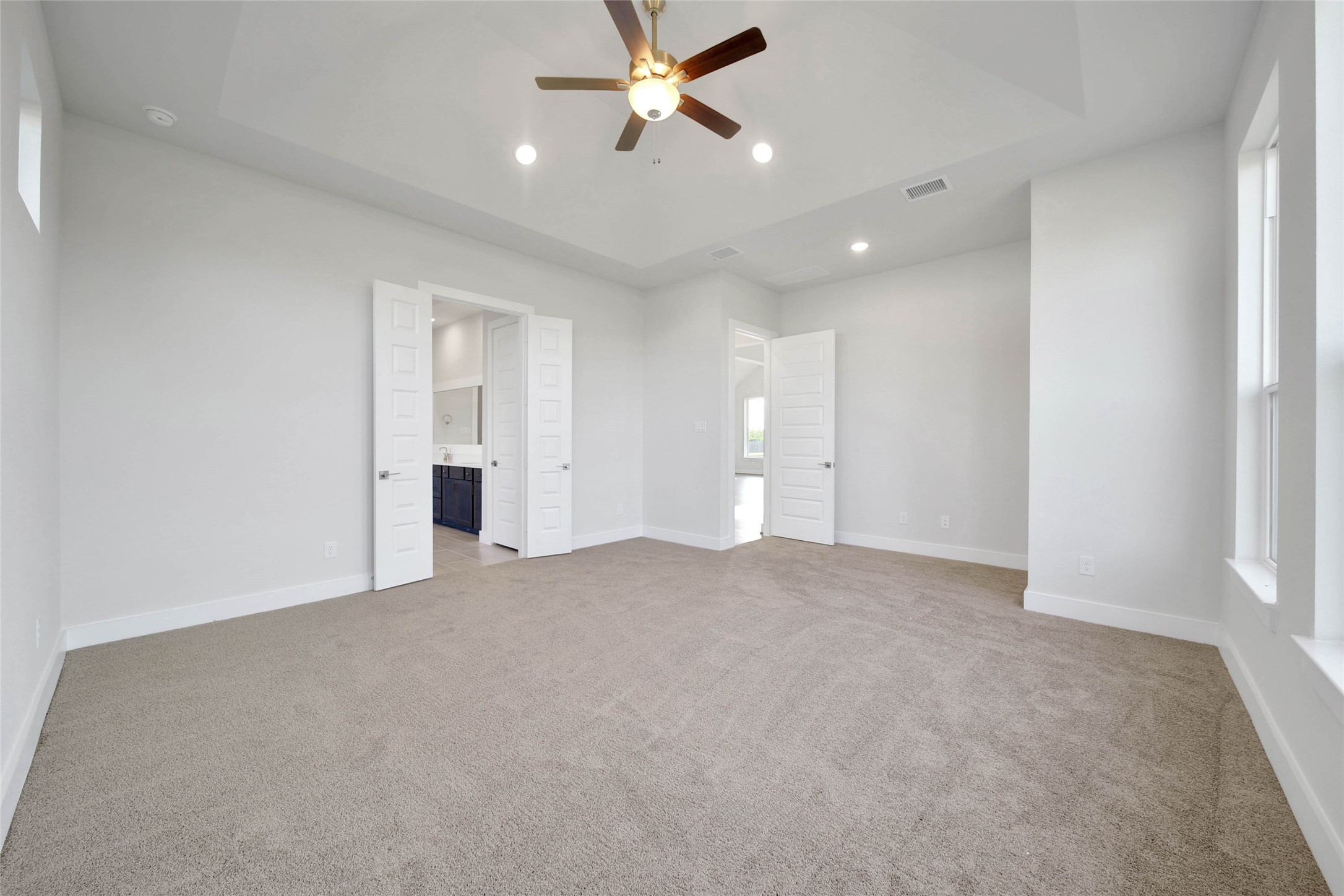 4515 Magnolia Bend Drive Rosharon, TX 77583 - Photo 17 of 46 an empty room with fan and windows