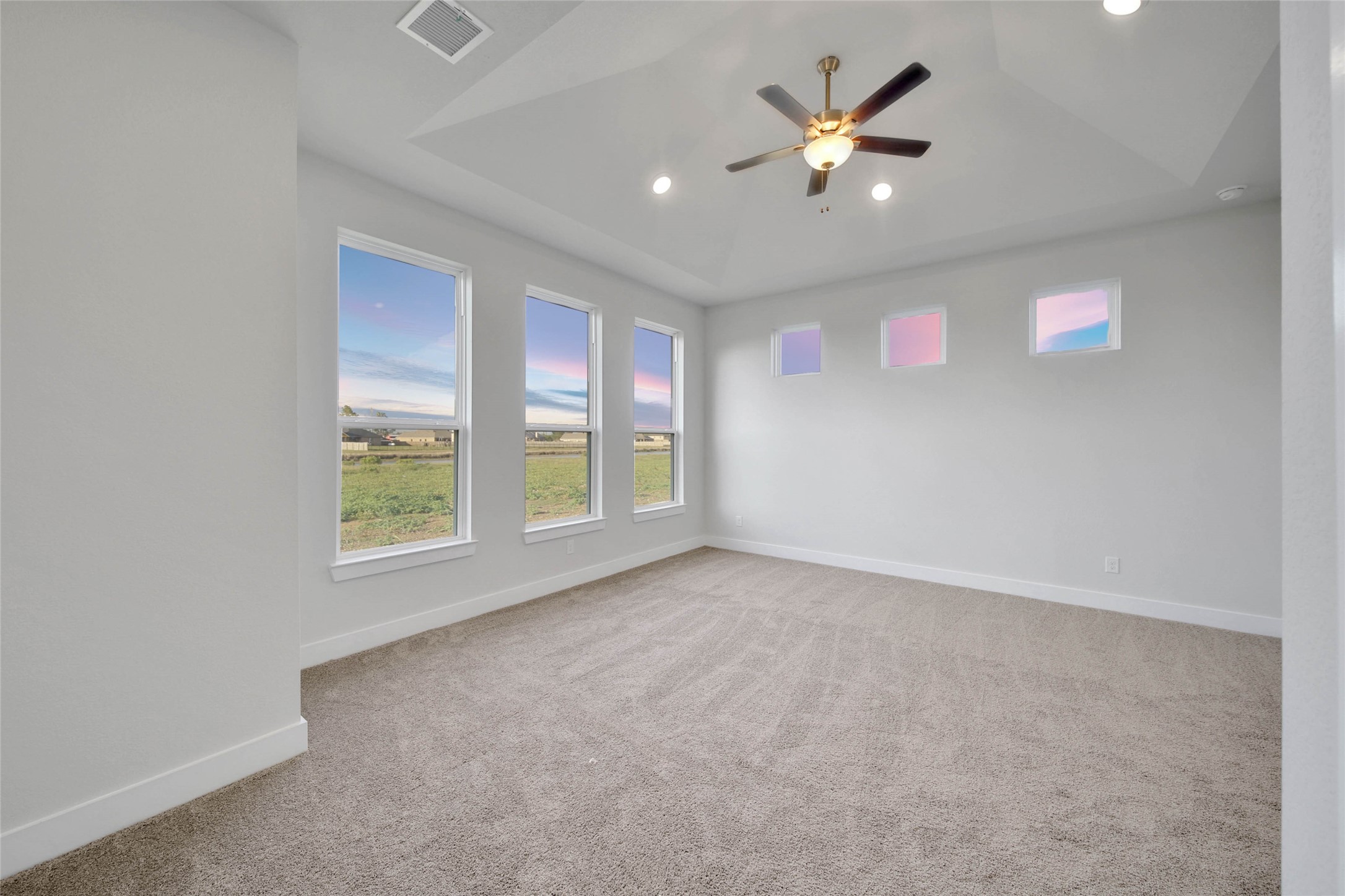 4515 Magnolia Bend Drive Rosharon, TX 77583 - Photo 18 of 46 an empty room with windows and ceiling fan