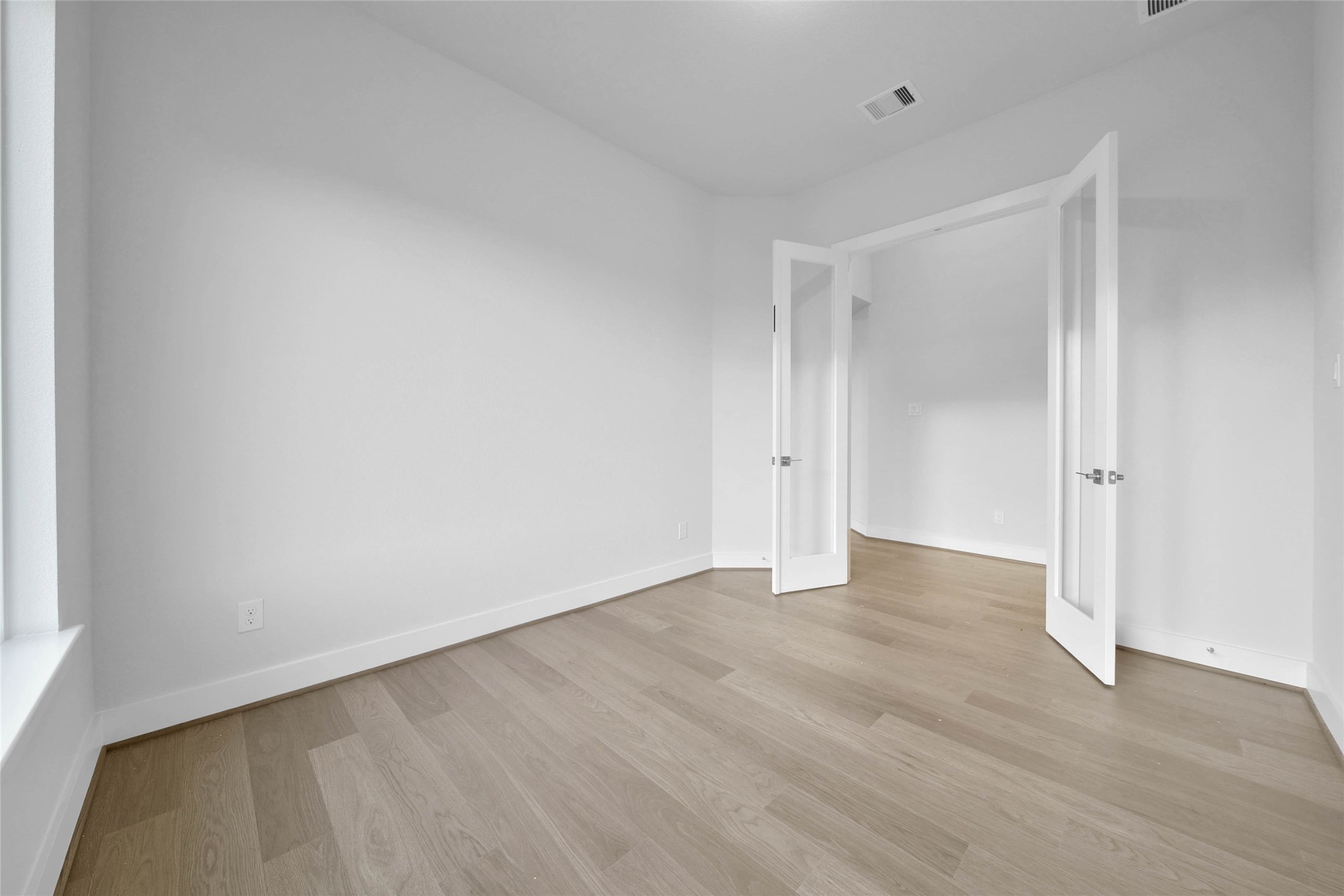 4515 Magnolia Bend Drive Rosharon, TX 77583 - Photo 25 of 46 a view of an empty room with wooden floor