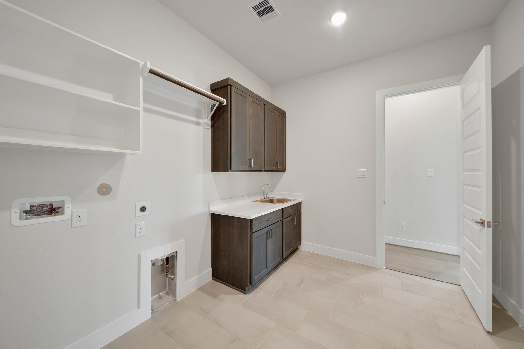 4515 Magnolia Bend Drive Rosharon, TX 77583 - Photo 36 of 46 a utility room with cabinets washer and dryer