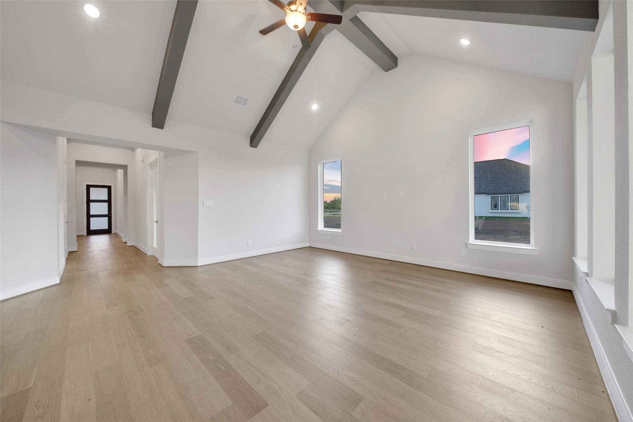 4515 Magnolia Bend Drive Rosharon, TX 77583 - Photo 5 of 46 a view of an empty room with a window and wooden floor