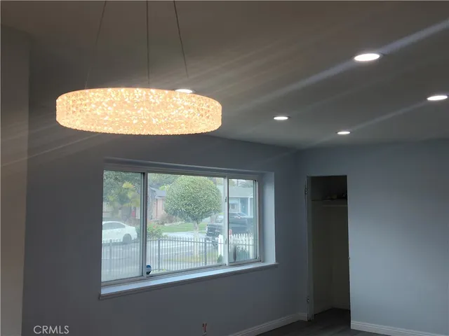 a view of an empty room and a window