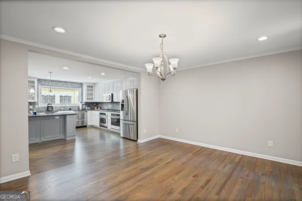 a bathroom with a granite countertop sink a toilet and a bathtub