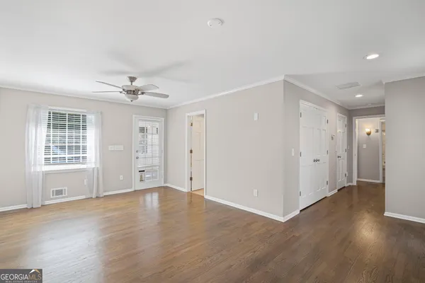 a bathroom with a double vanity sink mirror and shower