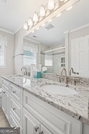 a view of a hallway with wooden floor and entryway
