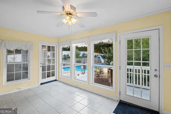 a view of a hallway with a chandelier