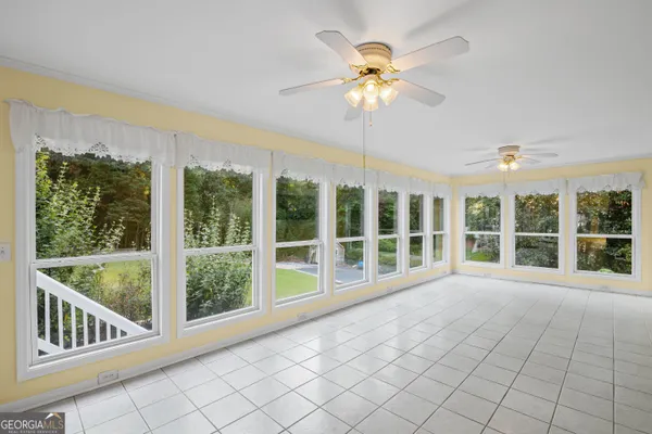 a backyard of a house with lots of green space and fountain
